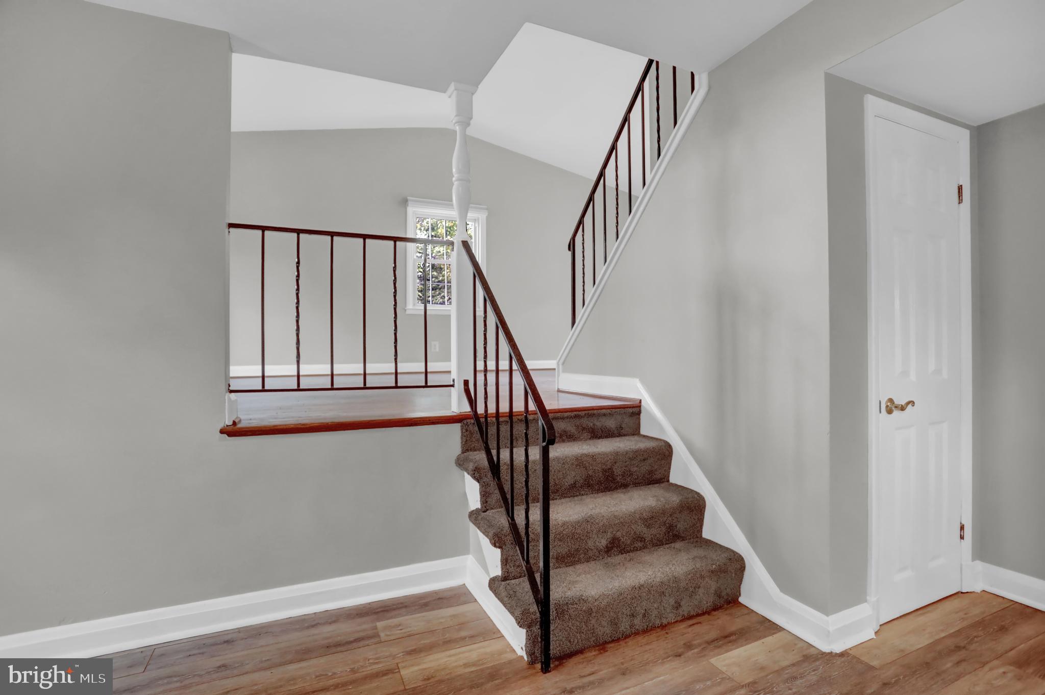829 Kellogg Road Lutherville-Timonium, MD 21093 - Photo 27 of 42 a view of entryway and hall with wooden floor