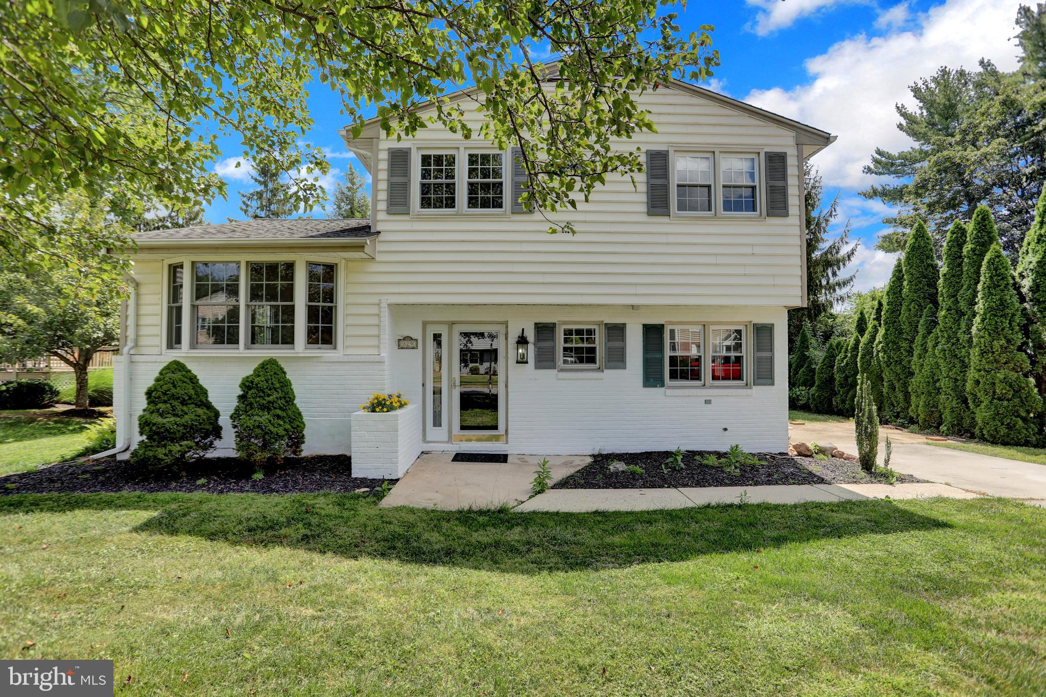 829 Kellogg Road Lutherville-Timonium, MD 21093 - Photo 42 of 42 a view of a white house with a yard and plants