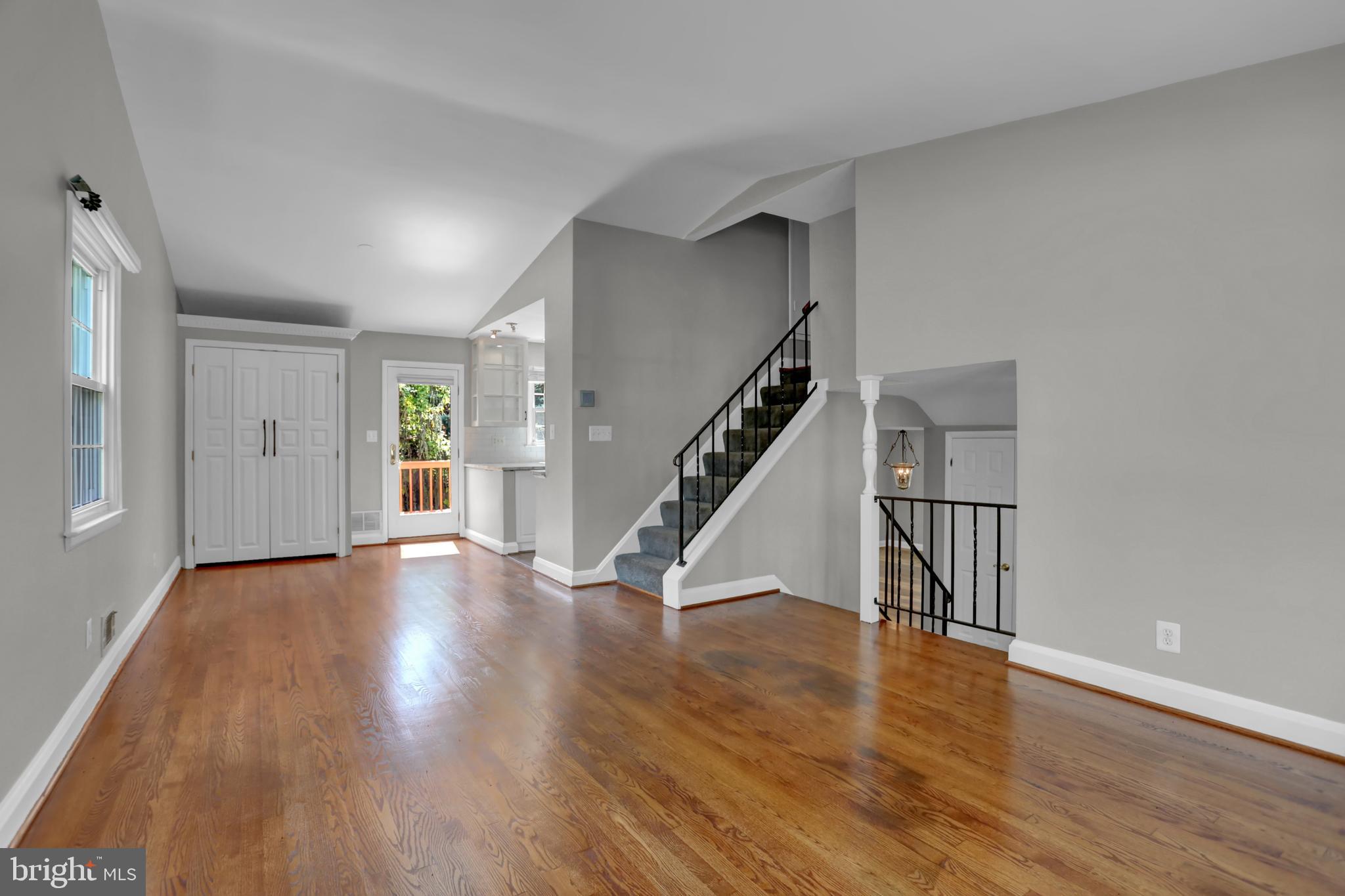 829 Kellogg Road Lutherville-Timonium, MD 21093 - Photo 9 of 42 a view of an empty room with wooden floor and stairs