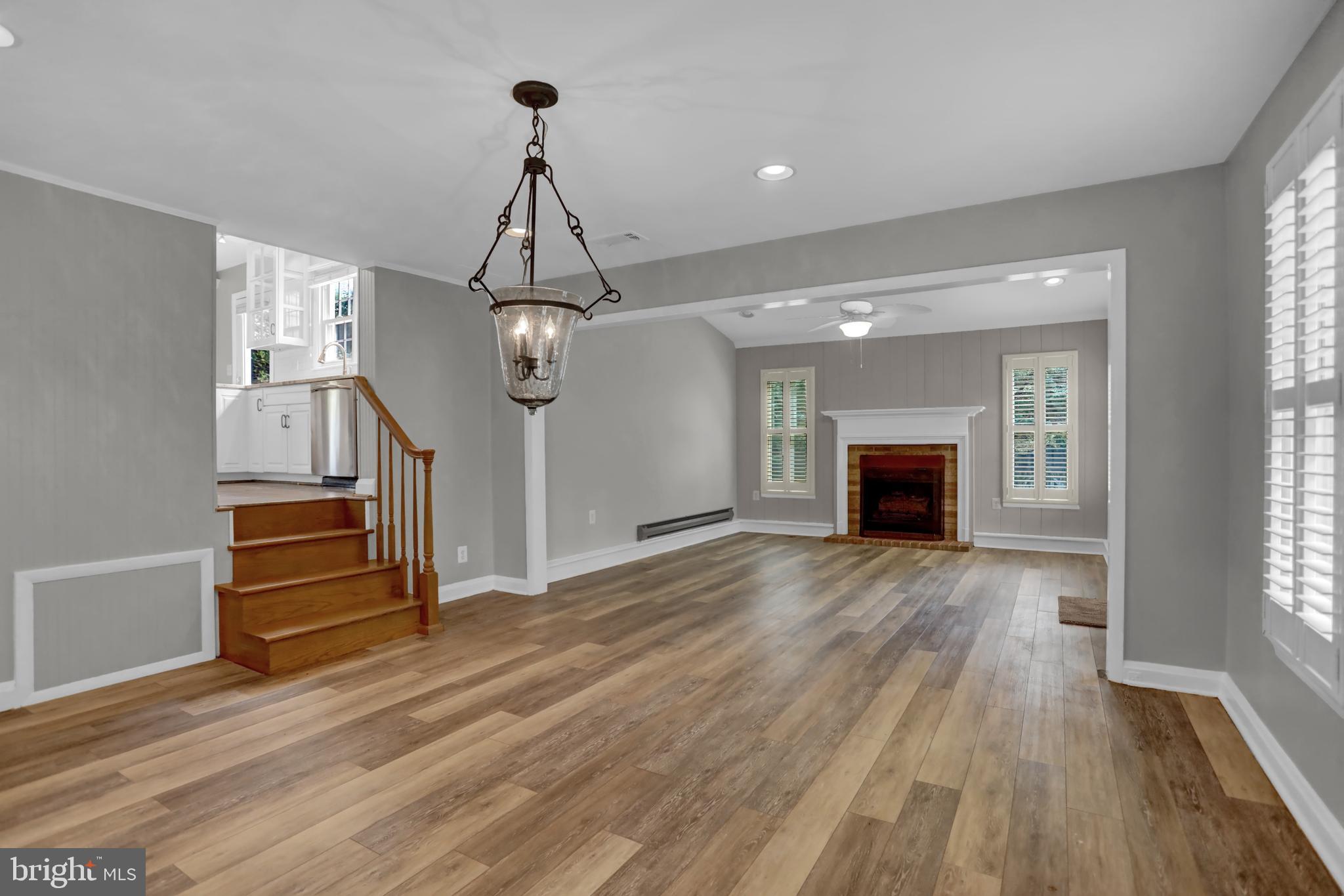829 Kellogg Road Lutherville-Timonium, MD 21093 - Photo 10 of 42 a view of empty room with wooden floor and fireplace