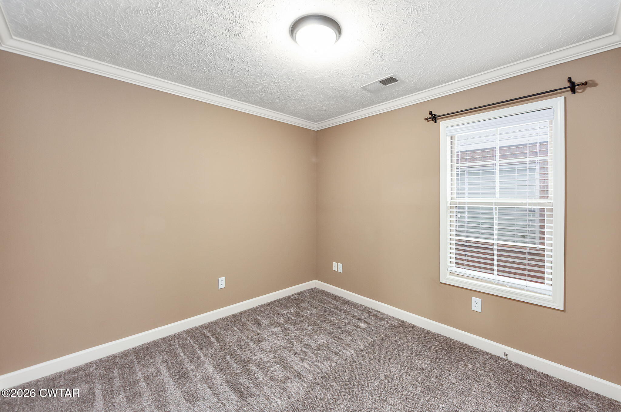 9 Sandbourne Cove Jackson, TN 38305 - Photo 15 of 22 a view of an empty room with a window