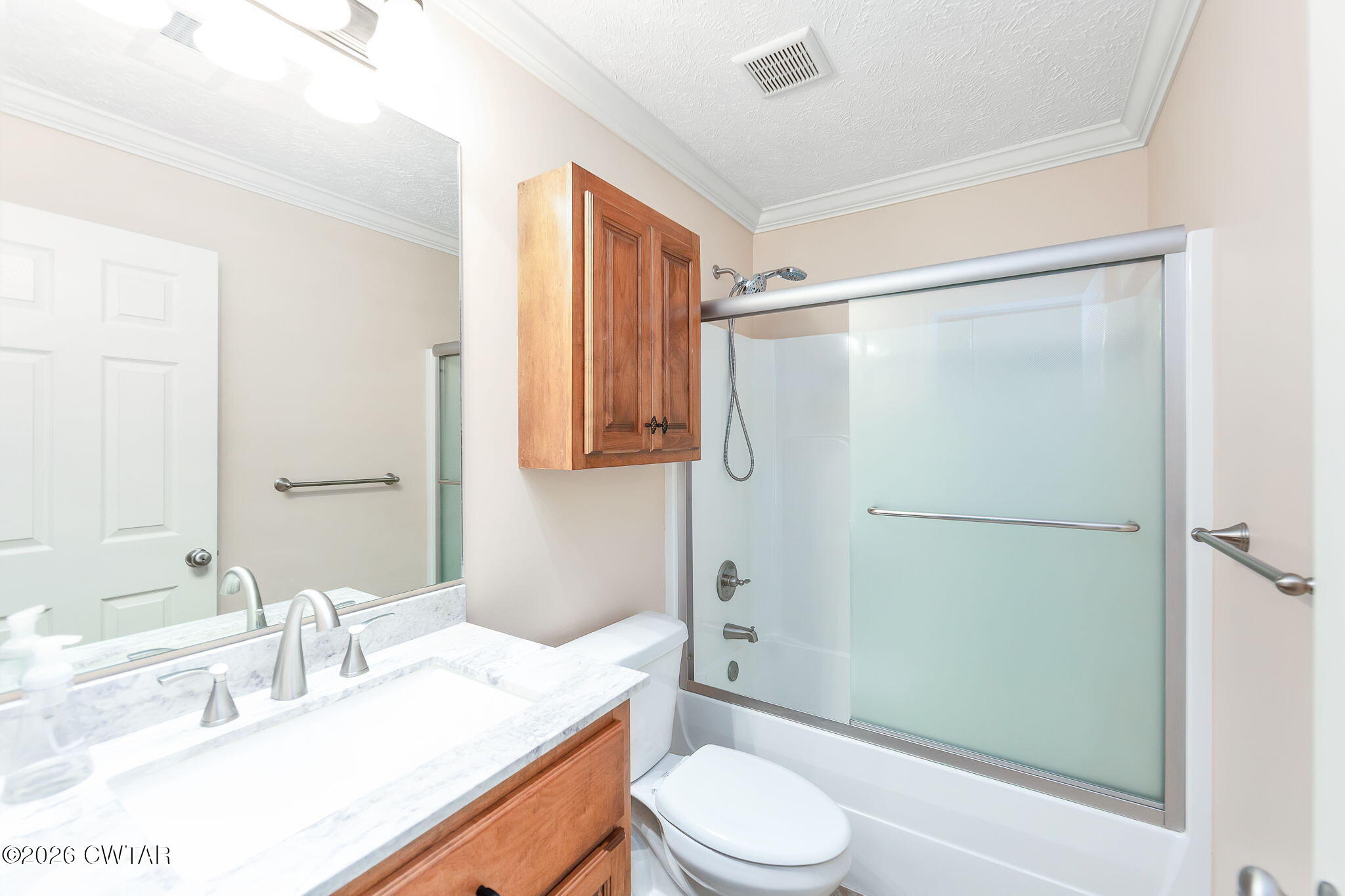9 Sandbourne Cove Jackson, TN 38305 - Photo 16 of 22 a bathroom with a sink a toilet and shower