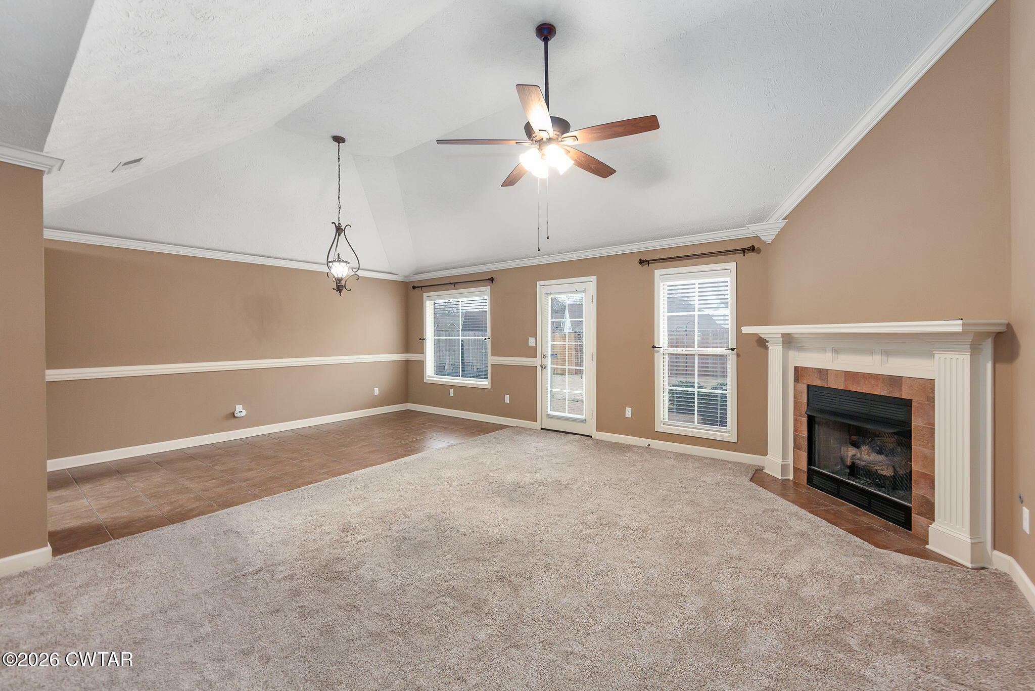 9 Sandbourne Cove Jackson, TN 38305 - Photo 2 of 22 a view of empty room with a fireplace and fan