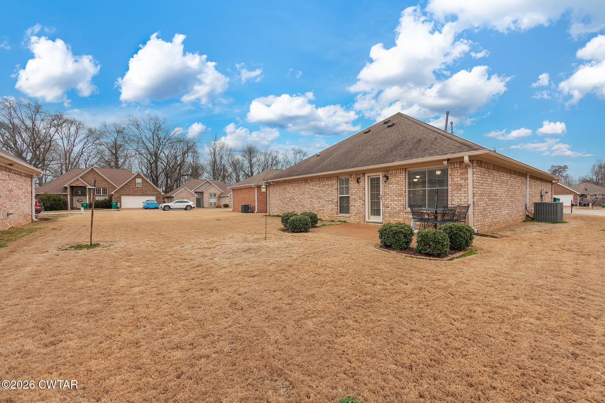 9 Sandbourne Cove Jackson, TN 38305 - Photo 21 of 22 a view of a house with a yard