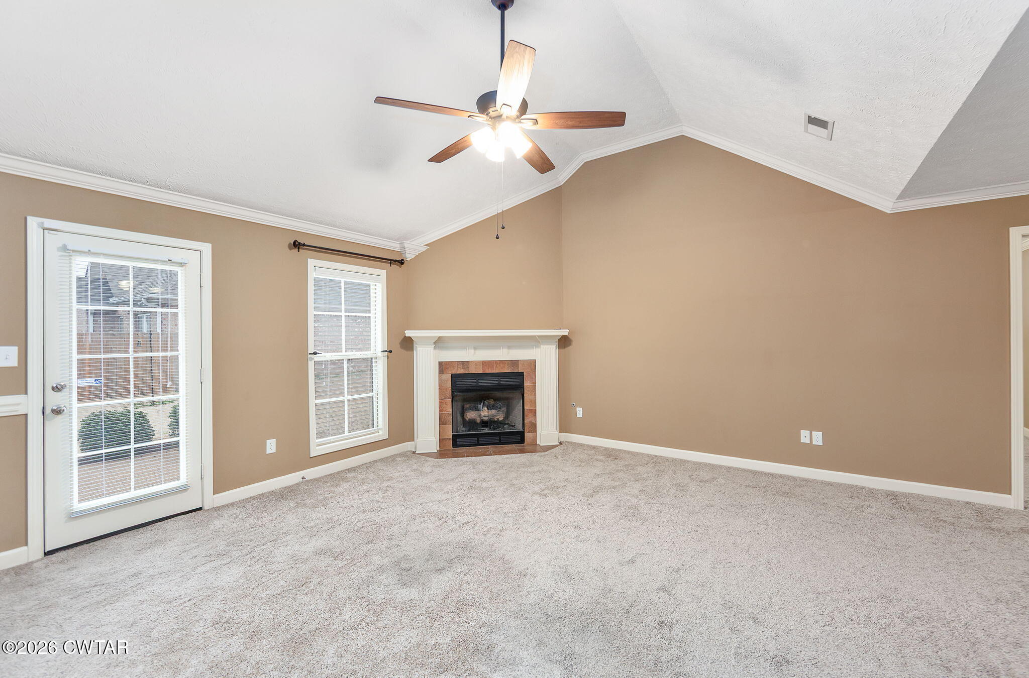 9 Sandbourne Cove Jackson, TN 38305 - Photo 3 of 22 a view of an empty room with window and fire place