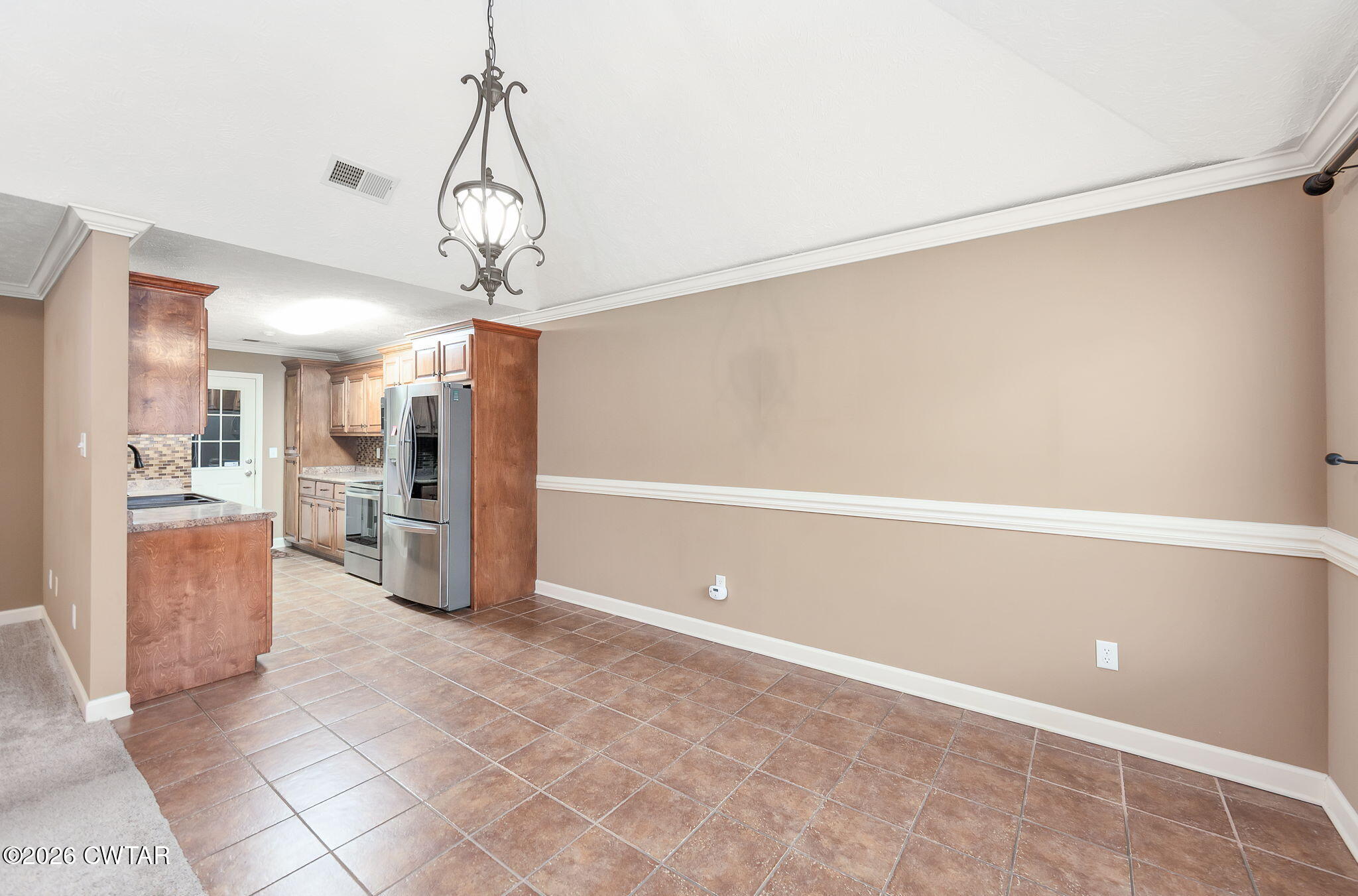 9 Sandbourne Cove Jackson, TN 38305 - Photo 5 of 22 a view of a kitchen with a refrigerator and a sink