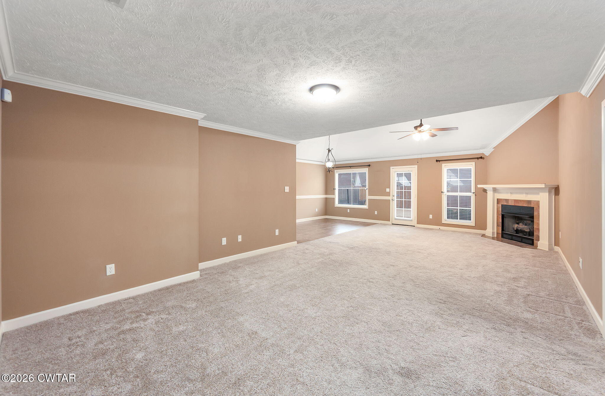 9 Sandbourne Cove Jackson, TN 38305 - Photo 7 of 22 a view of a livingroom with an empty space and a fireplace