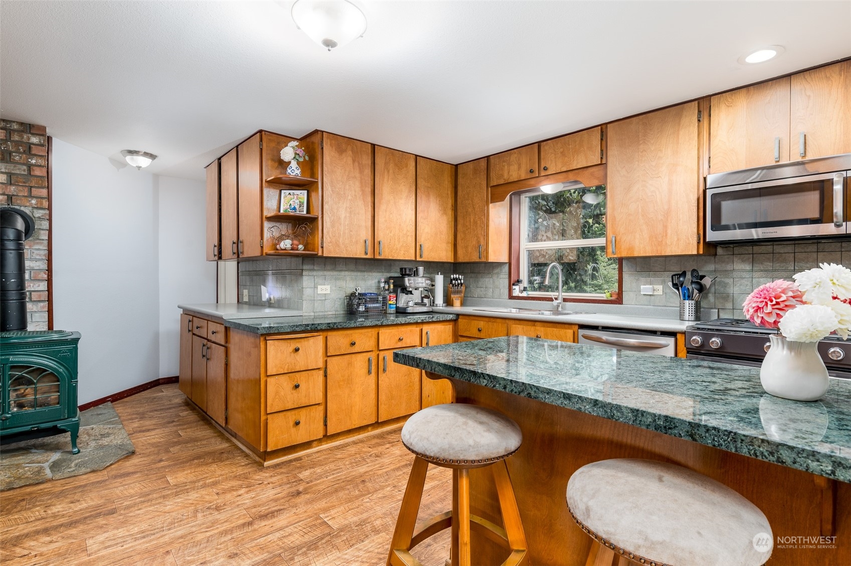 6283 Noon Road Everson, WA 98247 - Photo 17 of 40 a kitchen with sink a window and chairs