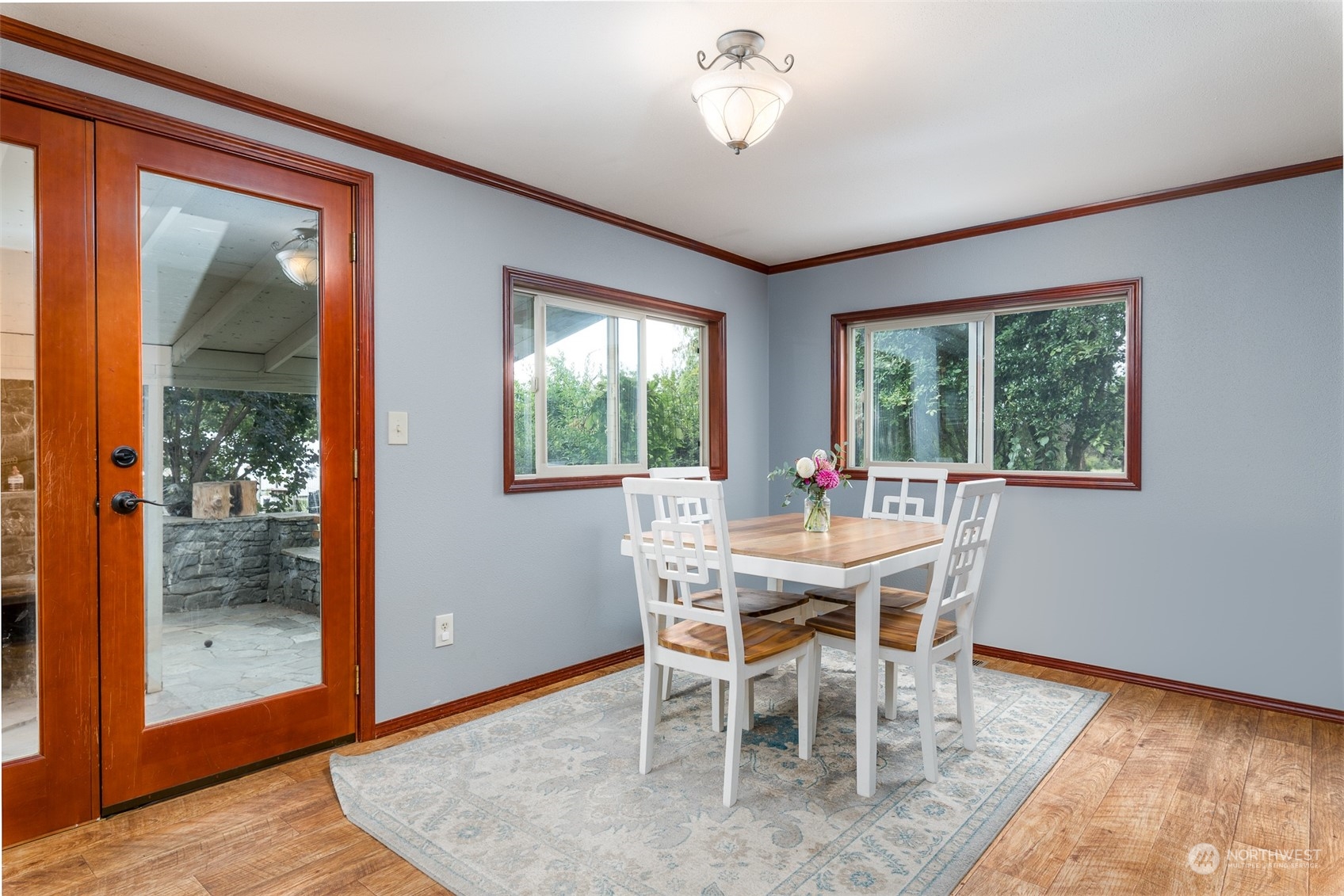6283 Noon Road Everson, WA 98247 - Photo 18 of 40 a view of a dining room with furniture wooden floor and a chandelier