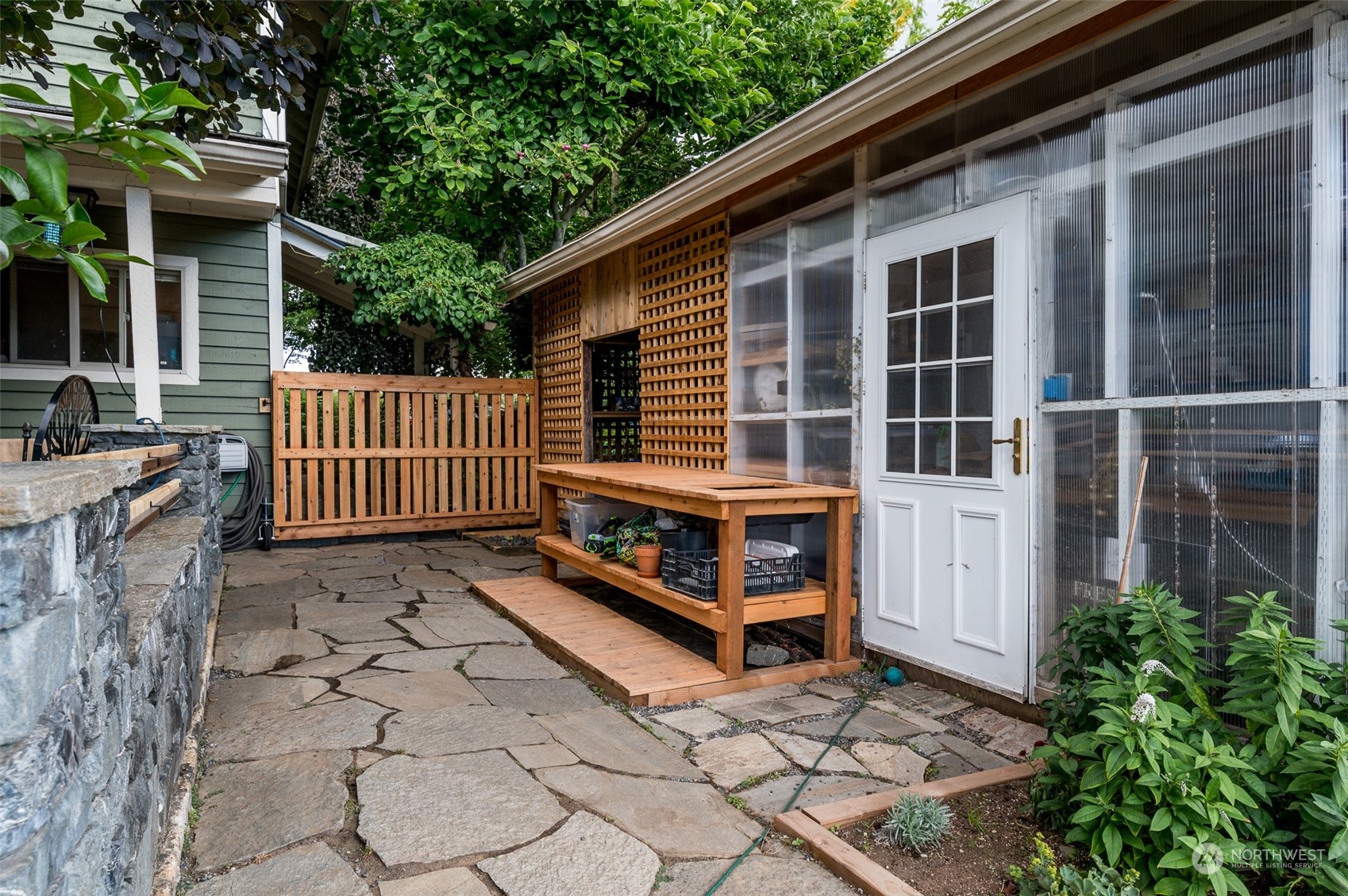 6283 Noon Road Everson, WA 98247 - Photo 31 of 40 a view of house with a large window and wooden fence
