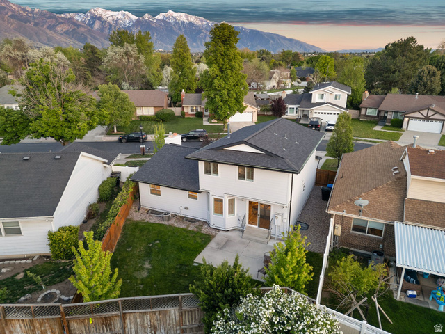 1405 Vintry Lane Murray, UT 84121 - Photo 43 of 44 White-sided residence with dark shingle roofing