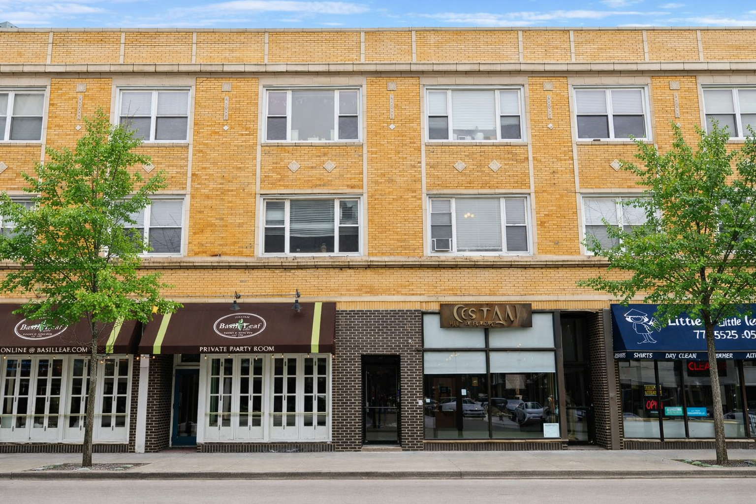a front view of a building with glass windows