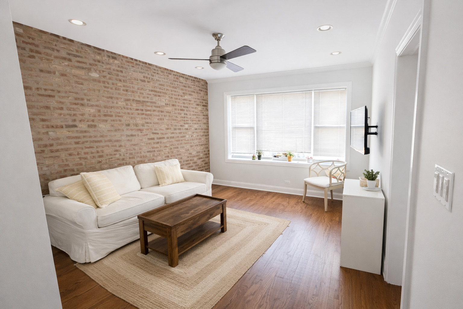 2467 North Clark Street, Unit 3 Chicago, IL 60614 - Photo 4 of 8 a living room with furniture and a wooden floor