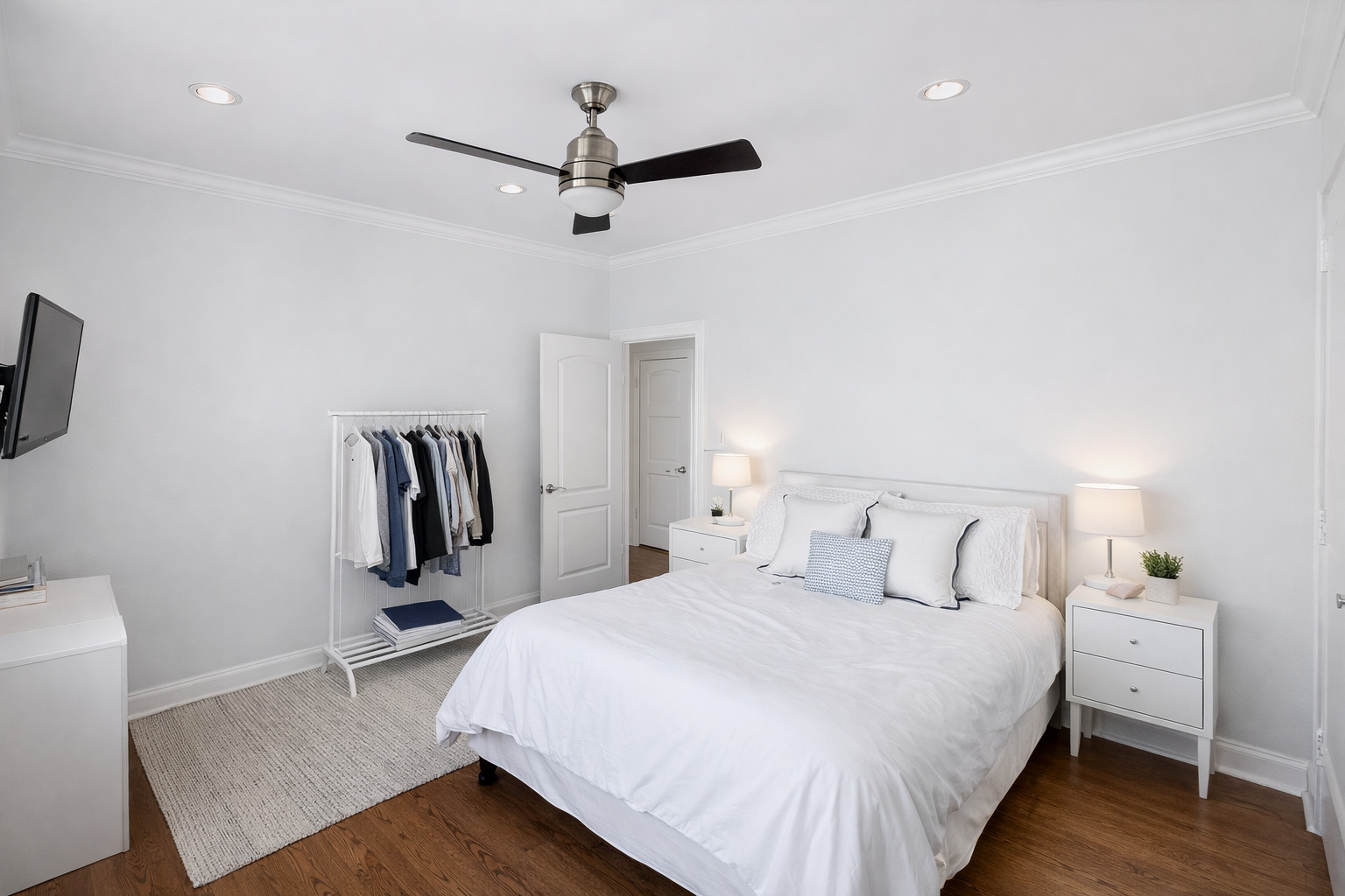 2467 North Clark Street, Unit 3 Chicago, IL 60614 - Photo 6 of 8 a bedroom with a bed and a flat screen tv