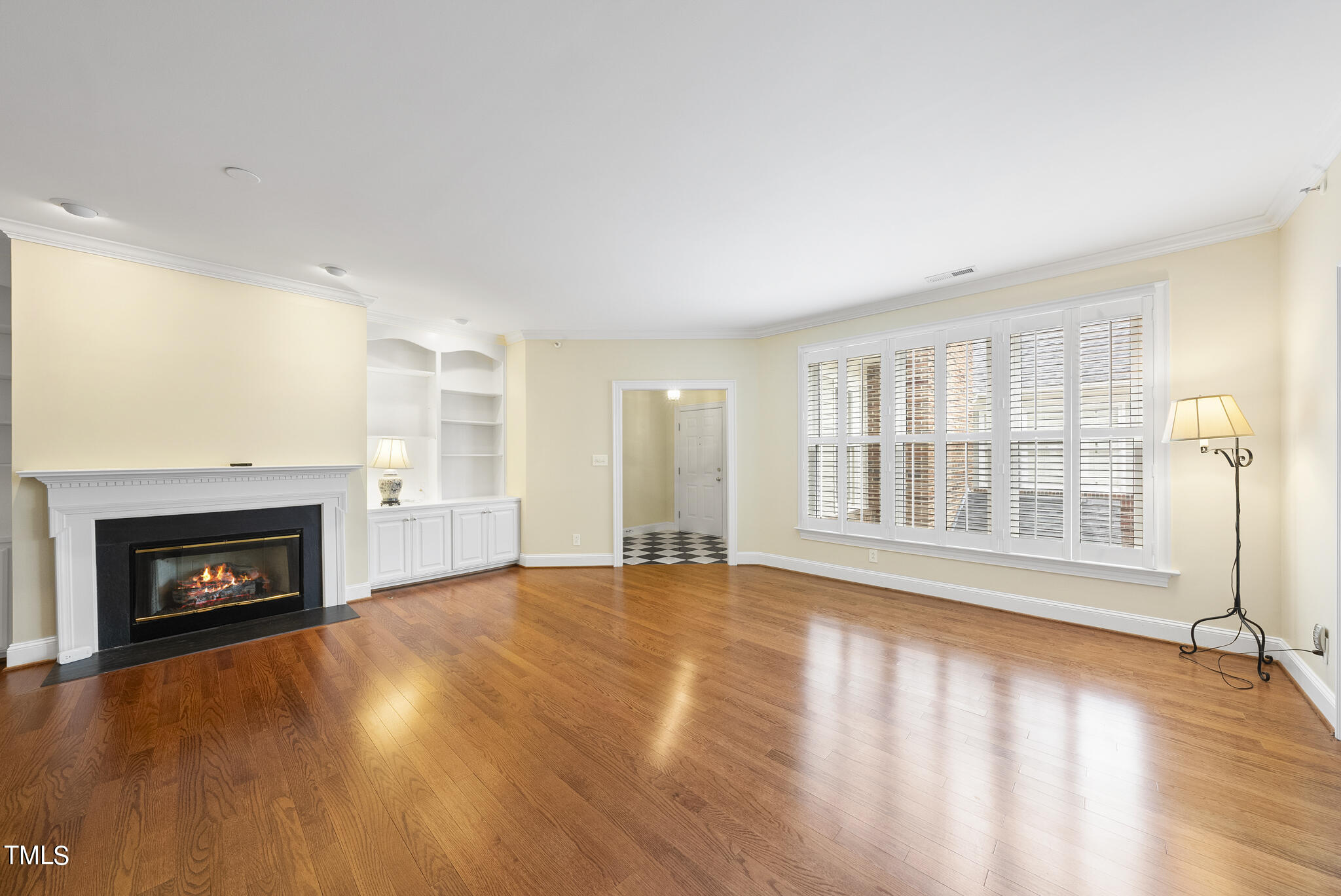 100 Edenburgh Road, Unit 304 Raleigh, NC 27608 - Photo 2 of 38 a view of an empty room with a fireplace and a window