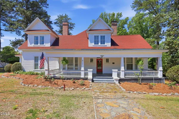 front view of a house with a swimming pool