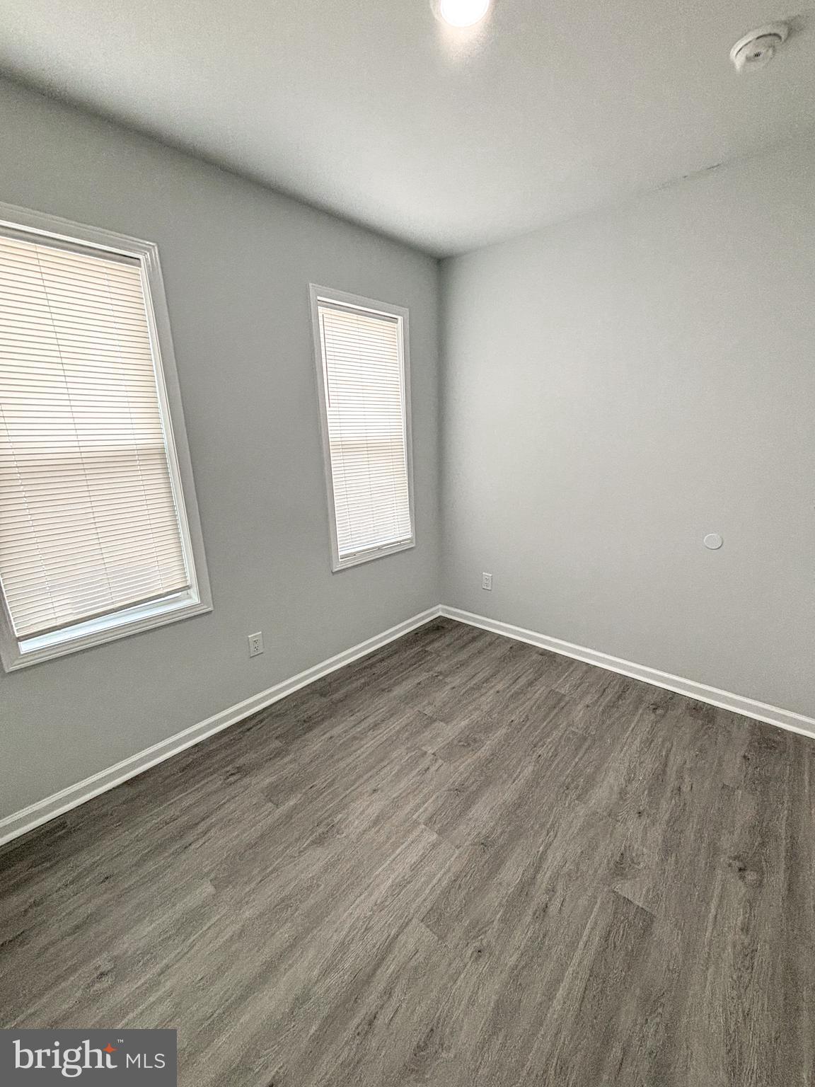 3631 Reed Street Philadelphia, PA 19146 - Photo 12 of 21 an empty room with wooden floor and windows