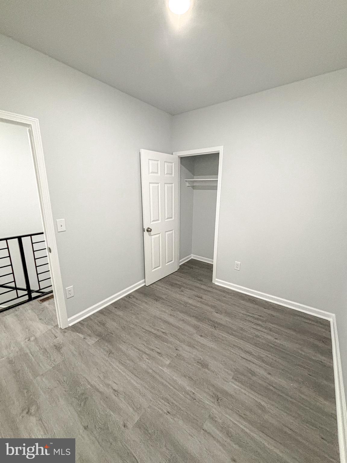3631 Reed Street Philadelphia, PA 19146 - Photo 16 of 21 an empty room with wooden floor and windows