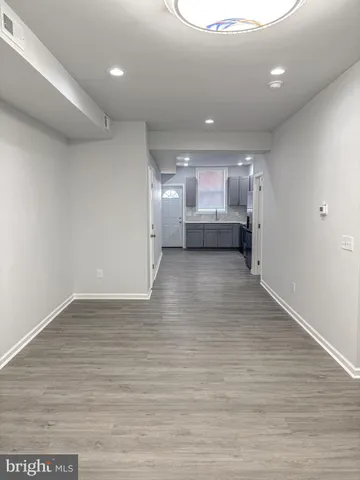 a kitchen with a refrigerator a sink and cabinets
