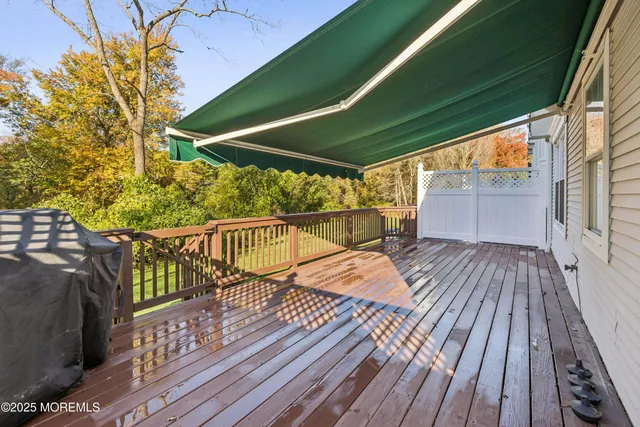 a view of balcony with wooden floor and outdoor space