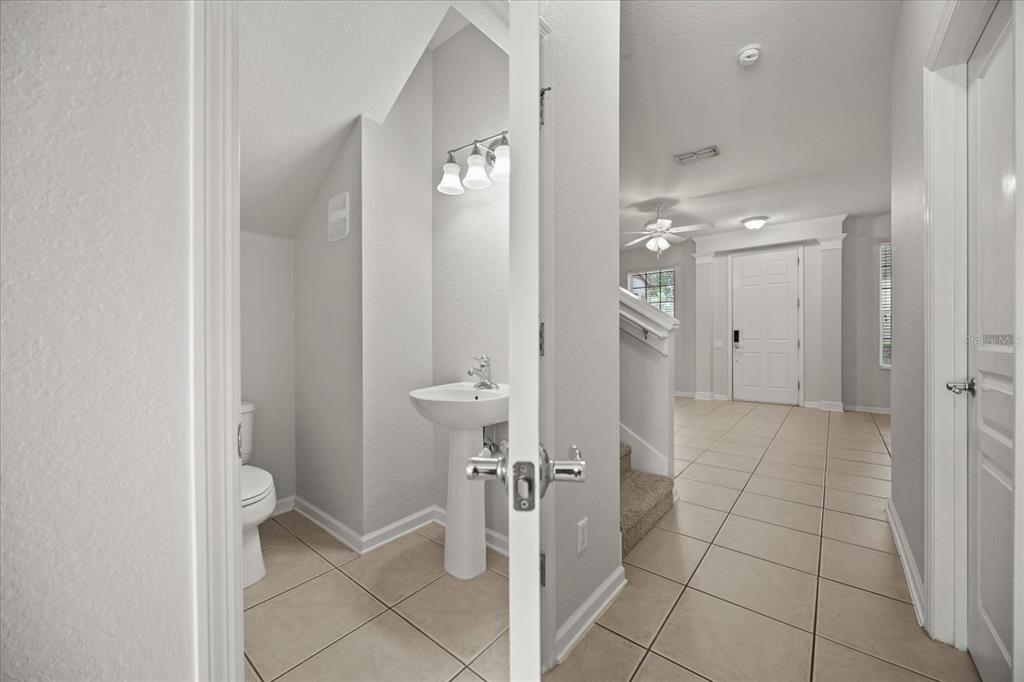 7719 Anselmo Lane Windermere, FL 34786 - Photo 12 of 31 a bathroom with a shower and a sink