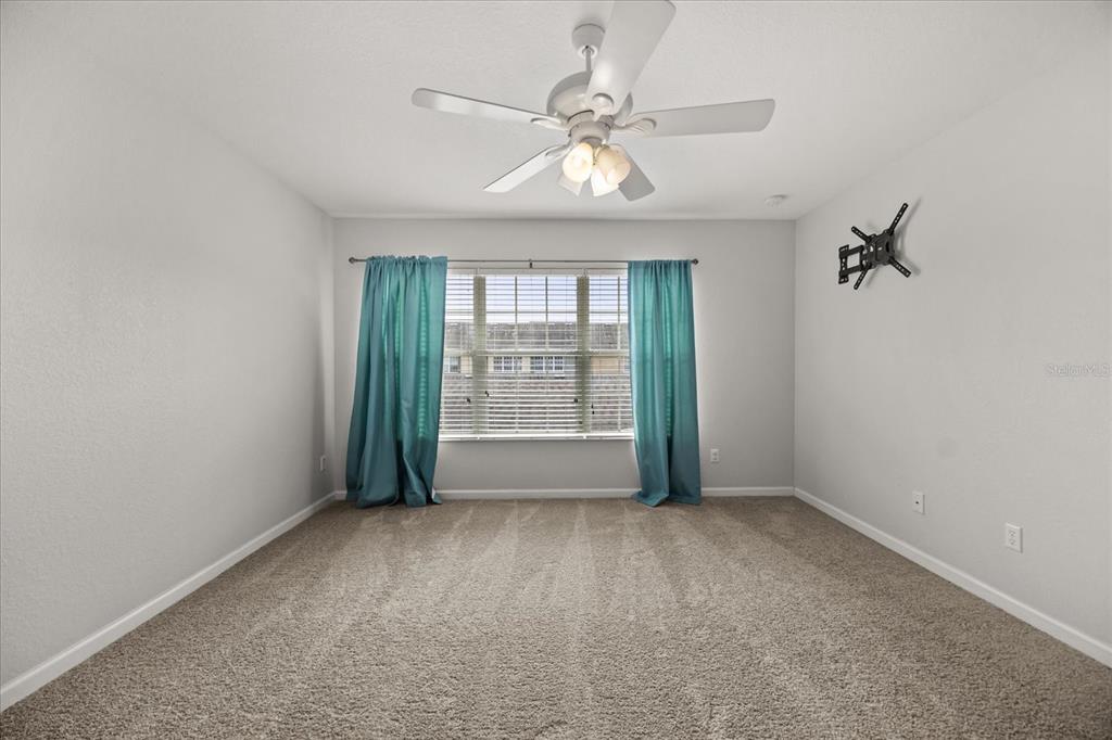 7719 Anselmo Lane Windermere, FL 34786 - Photo 15 of 31 a view of an empty room with a window