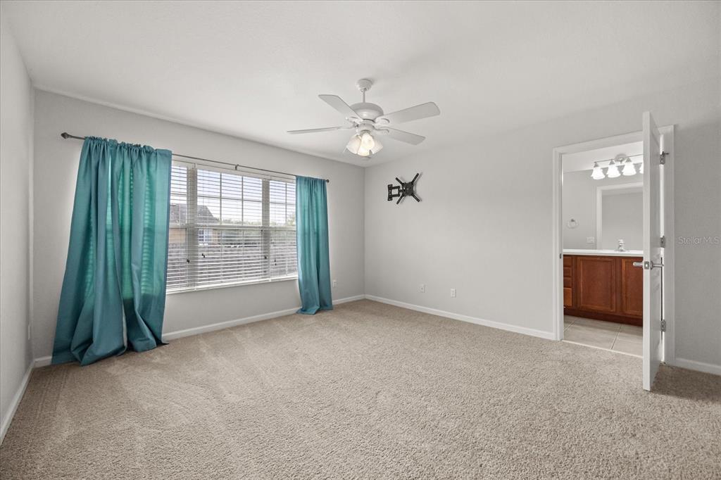 7719 Anselmo Lane Windermere, FL 34786 - Photo 16 of 31 a view of an empty room with a window