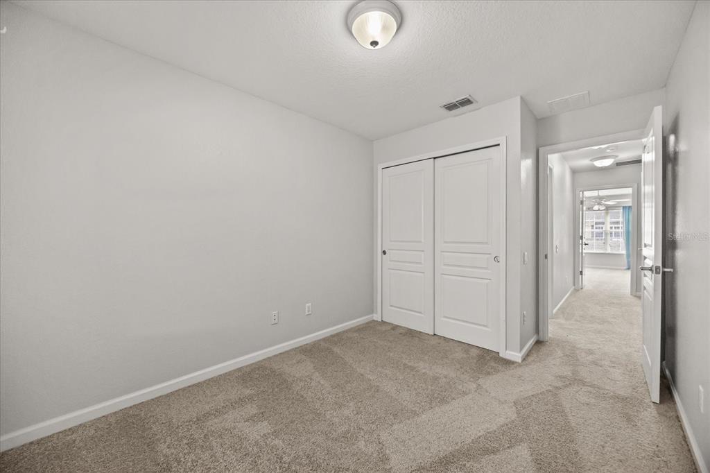 7719 Anselmo Lane Windermere, FL 34786 - Photo 22 of 31 an empty room with closet area