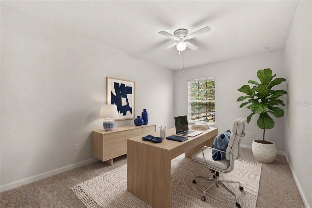 7719 Anselmo Lane Windermere, FL 34786 - Photo 23 of 31 a view of a workspace with furniture and a potted plant