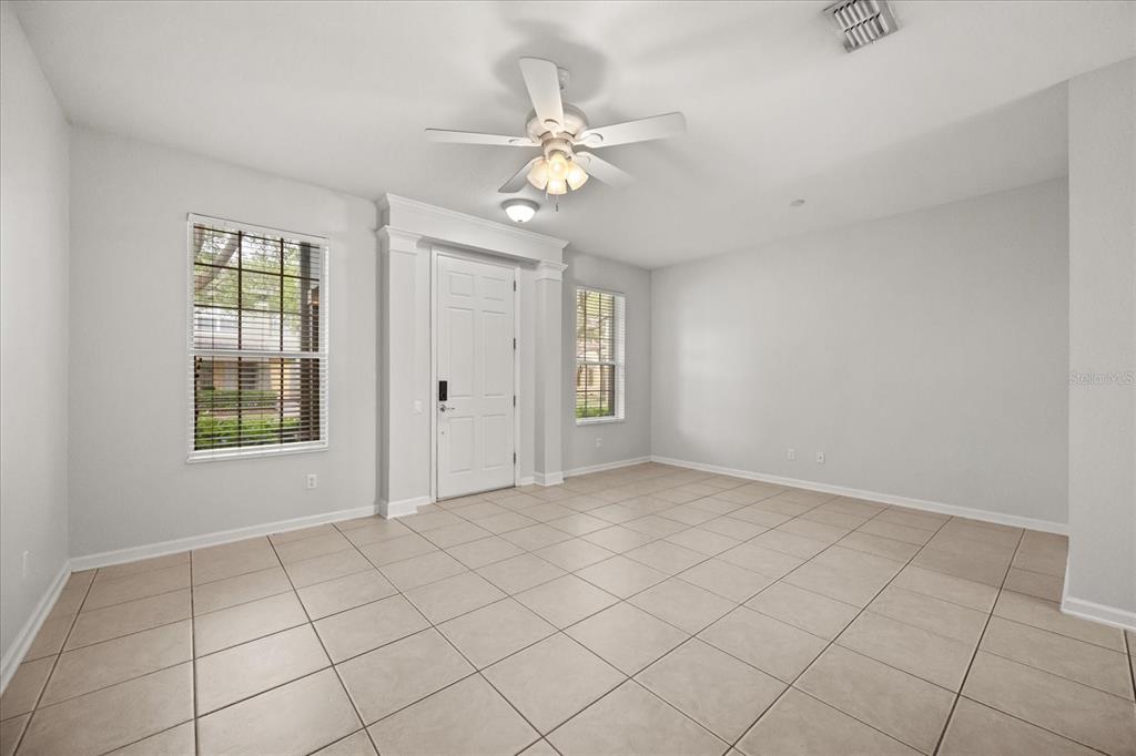 7719 Anselmo Lane Windermere, FL 34786 - Photo 3 of 31 a view of an empty room with a window