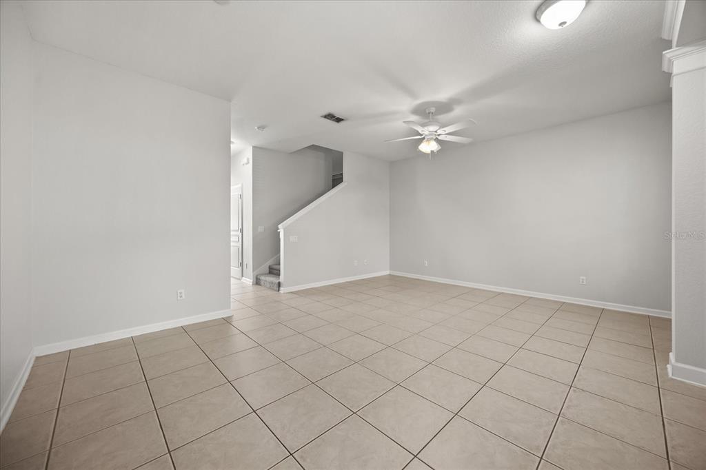 7719 Anselmo Lane Windermere, FL 34786 - Photo 6 of 31 an empty room with white walls and fan