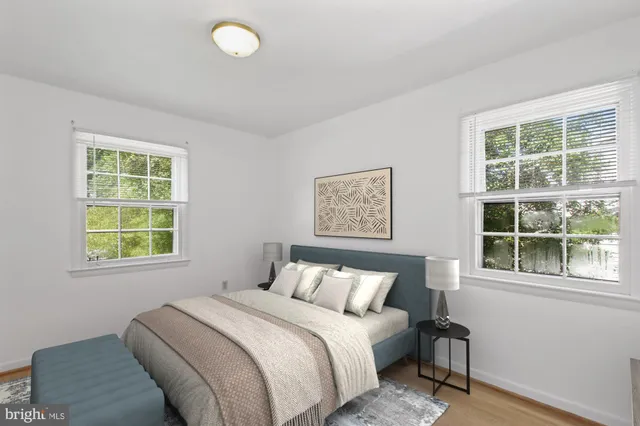 a bedroom with bed and a window