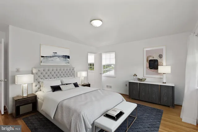 a bedroom with a bed and a night stand