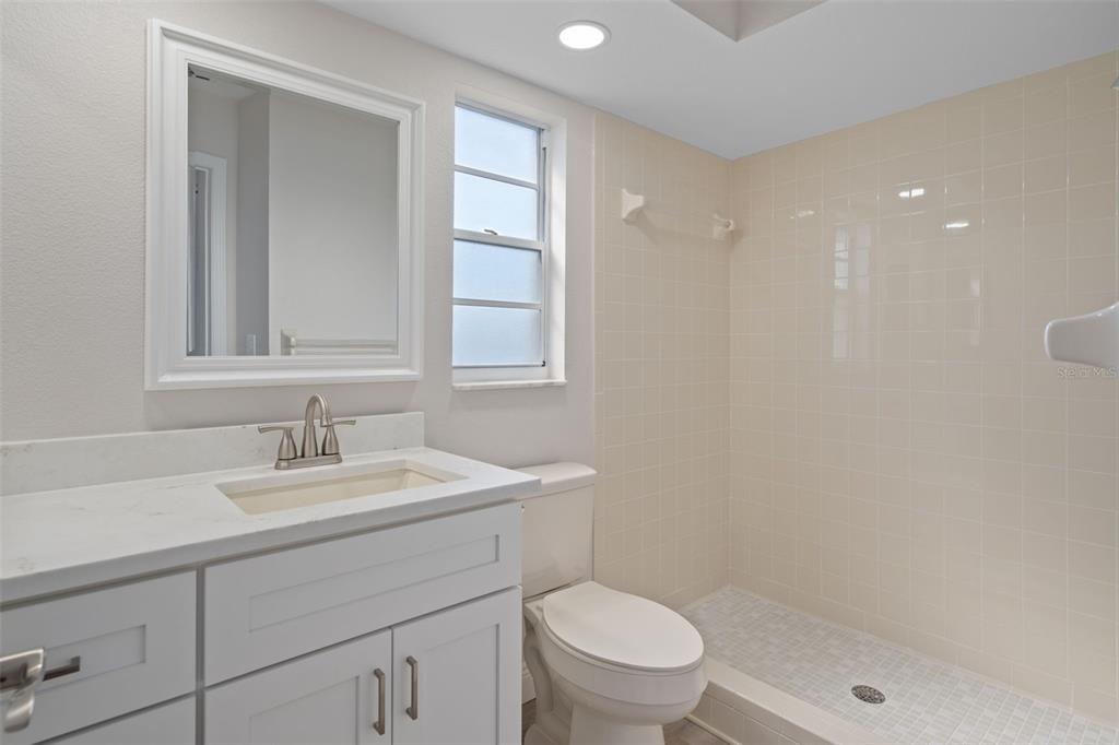 10352 Brentlawn Street Spring Hill, FL 34608 - Photo 22 of 35 a bathroom with a sink a toilet and shower