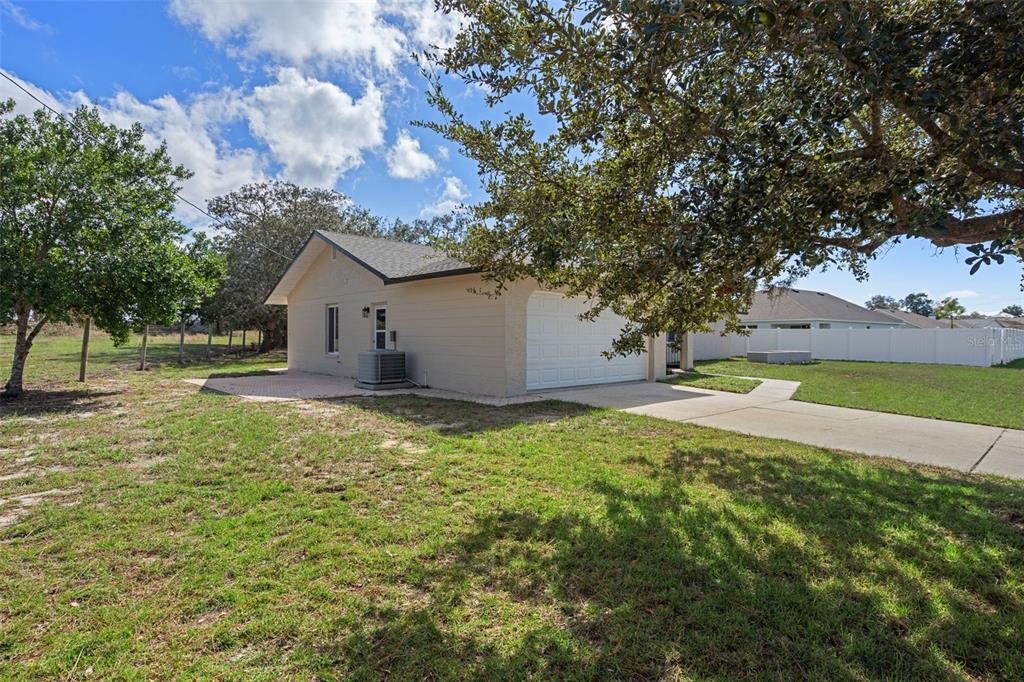 10352 Brentlawn Street Spring Hill, FL 34608 - Photo 29 of 35 a view of a house with a backyard