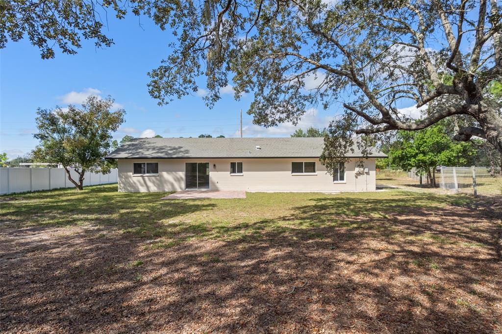 10352 Brentlawn Street Spring Hill, FL 34608 - Photo 30 of 35 a front view of a house with a yard