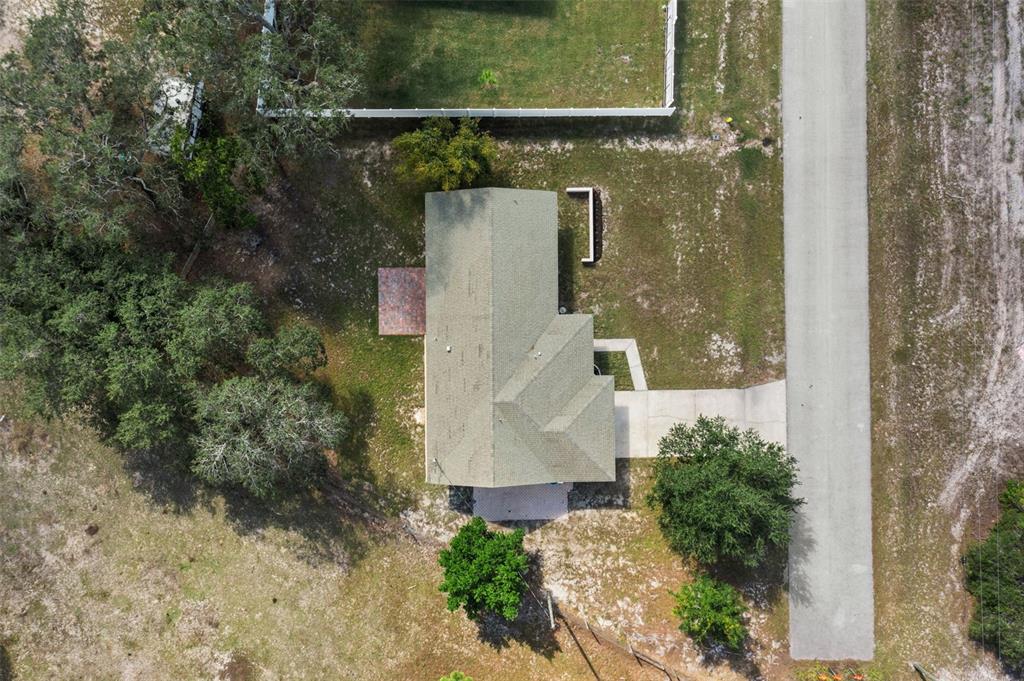 10352 Brentlawn Street Spring Hill, FL 34608 - Photo 33 of 35 an aerial view of a house with a yard