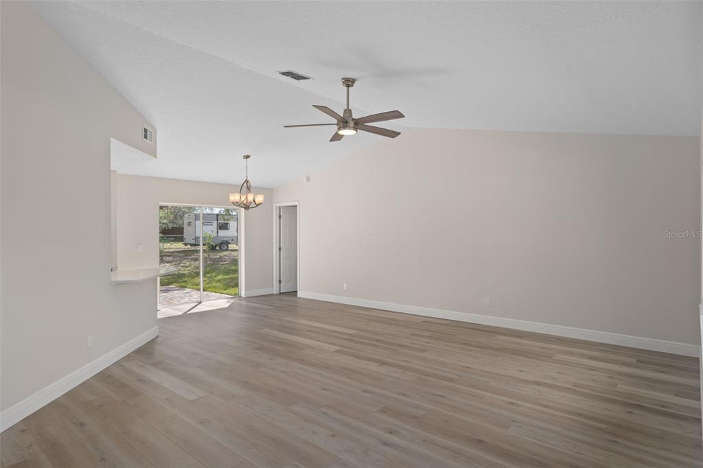 10352 Brentlawn Street Spring Hill, FL 34608 - Photo 4 of 35 wooden floor in an empty room