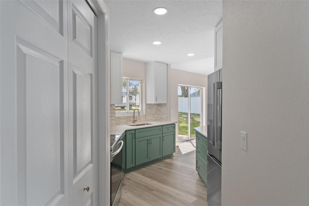 10352 Brentlawn Street Spring Hill, FL 34608 - Photo 7 of 35 a bathroom with a sink a toilet and shower