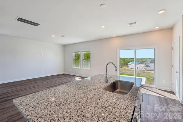 a kitchen with a table and window