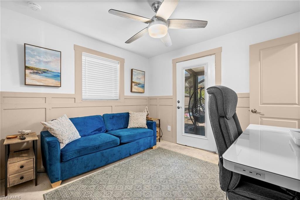 723 Park Avenue Naples, FL 34110 - Photo 18 of 48 a living room with furniture and a window