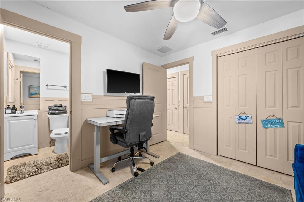 723 Park Avenue Naples, FL 34110 - Photo 19 of 48 a view of a workspace with furniture and a window
