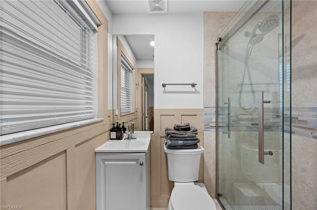 723 Park Avenue Naples, FL 34110 - Photo 22 of 48 a bathroom with a sink a toilet and shower