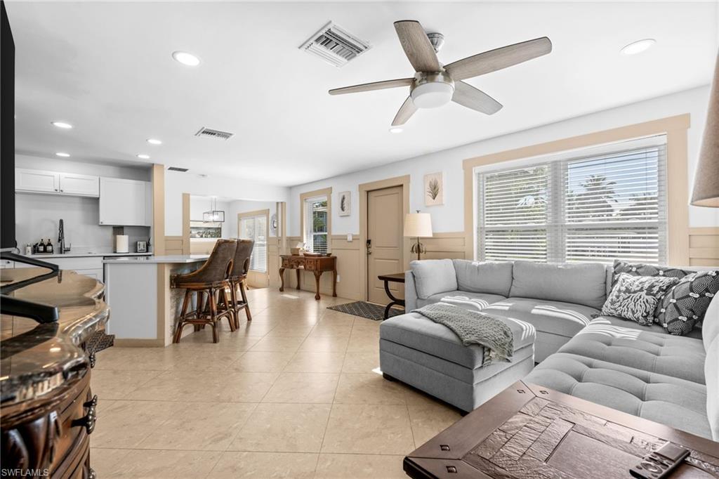723 Park Avenue Naples, FL 34110 - Photo 28 of 48 a living room with furniture and a large window