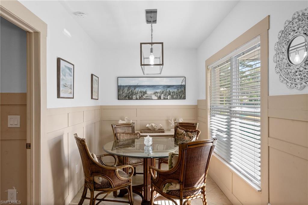 723 Park Avenue Naples, FL 34110 - Photo 36 of 48 a view of a dining room with furniture and window
