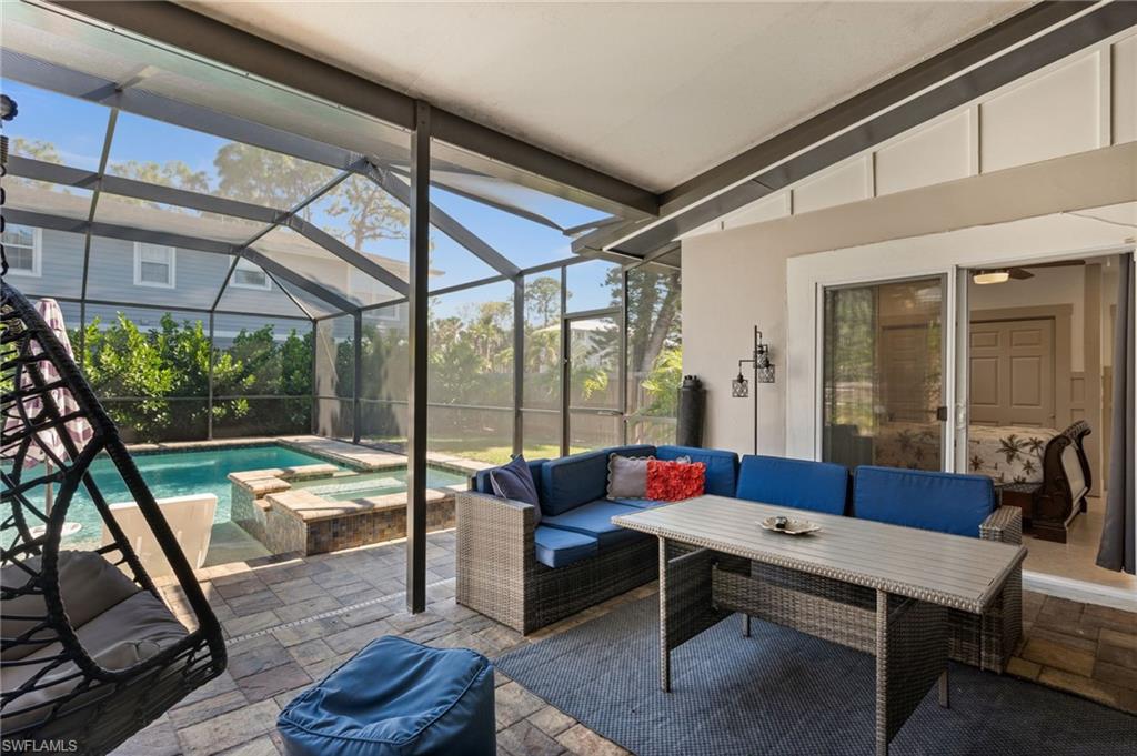 723 Park Avenue Naples, FL 34110 - Photo 43 of 48 a balcony with furniture and a potted plant