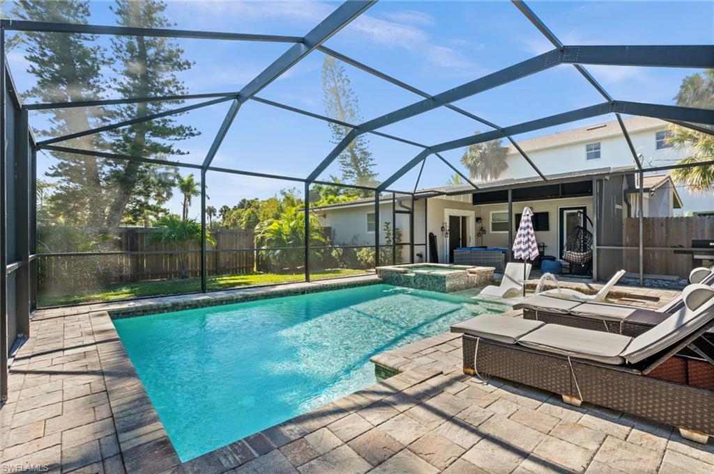 723 Park Avenue Naples, FL 34110 - Photo 46 of 48 a view of a swimming pool with a patio