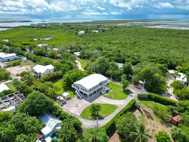 a aerial view of a house with a yard