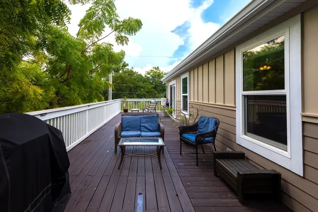 a view of two chairs in the balcony