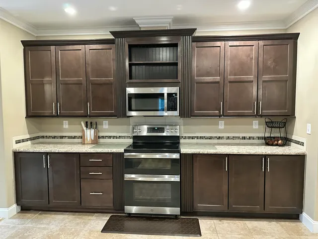 a kitchen with a sink and stainless steel appliances